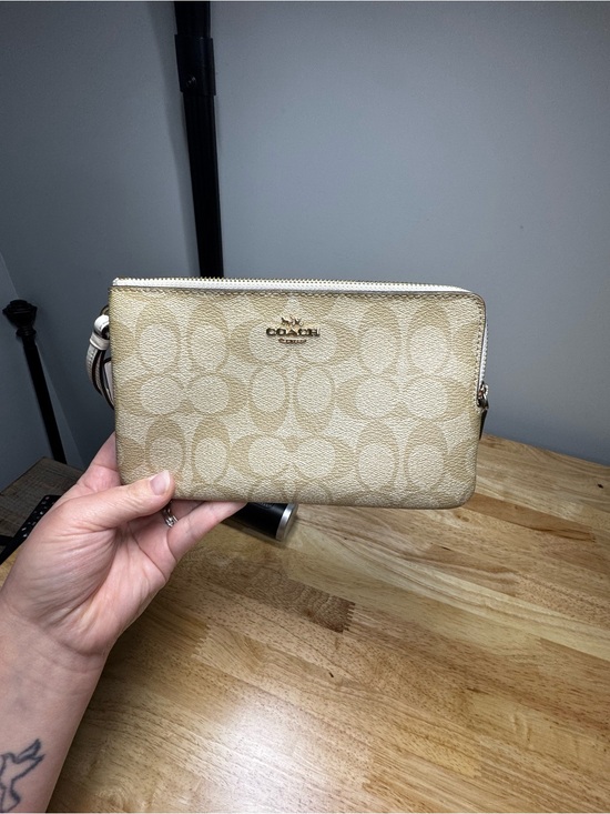 Coach Handbags - Coach Beige Signature Canvas Wristlet with Gold Logo